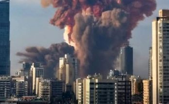 massive warehouse explosion sends towering red and gray smoke cloud over Beirut skyline