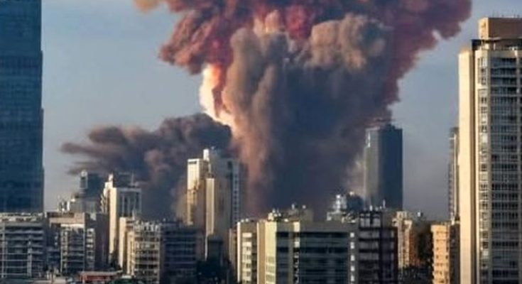 massive warehouse explosion sends towering red and gray smoke cloud over Beirut skyline
